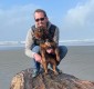 Justin and Olive on a giant log on the Washington Coast.